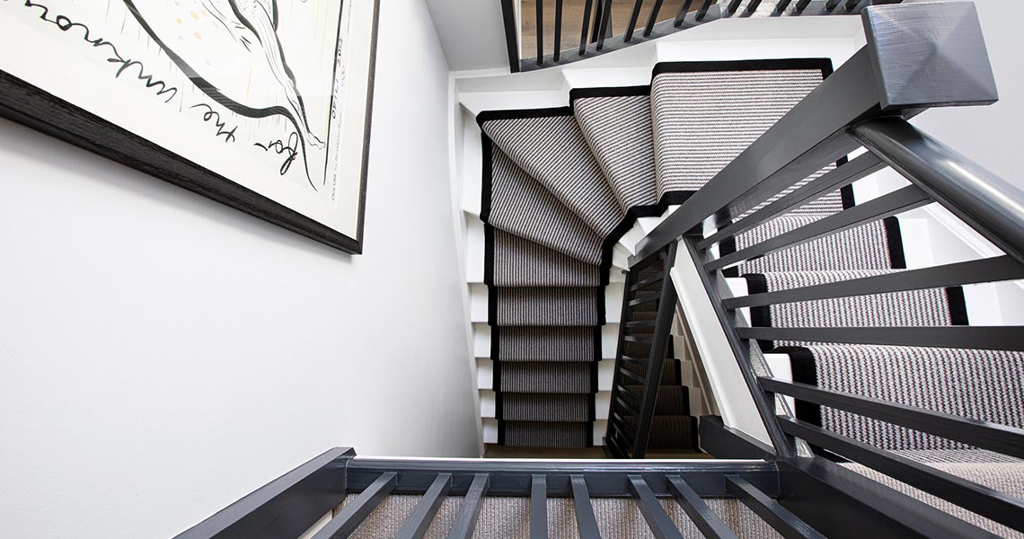 Custom revolving staircase leading to a loft conversions in london