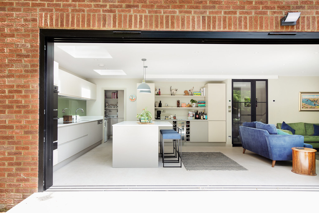 Open-plan kitchen extension with large glass doors in Richmond