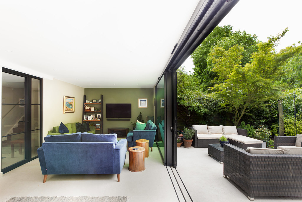 Modern open-plan kitchen-diner house extension in West London with garden views