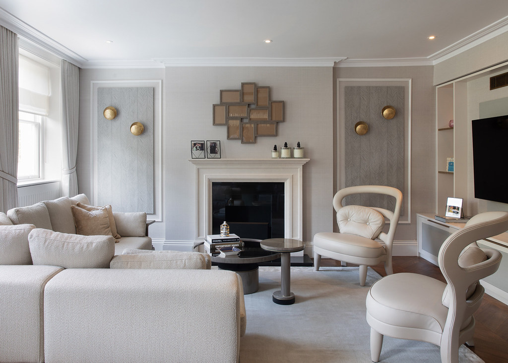 Skilled plasterer achieving a perfectly flat finish on a period property wall in North London