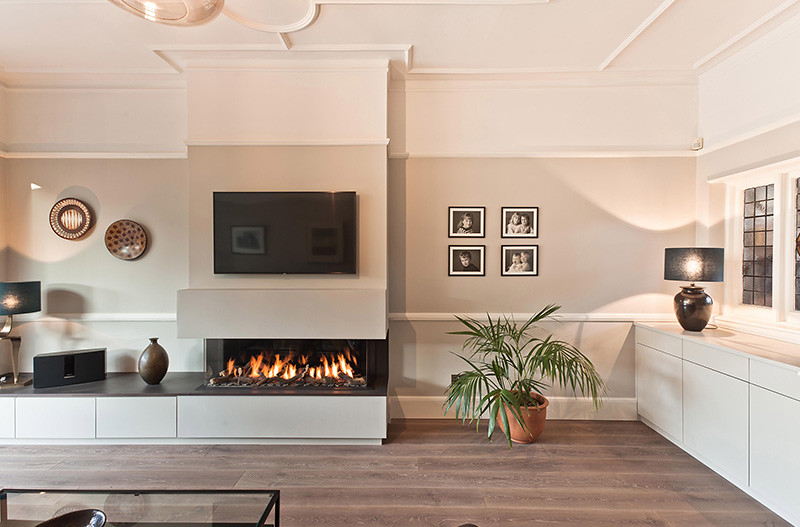 Bespoke wall-to-wall media unit with integrated lighting and cable management in a Brentford TW8 living room